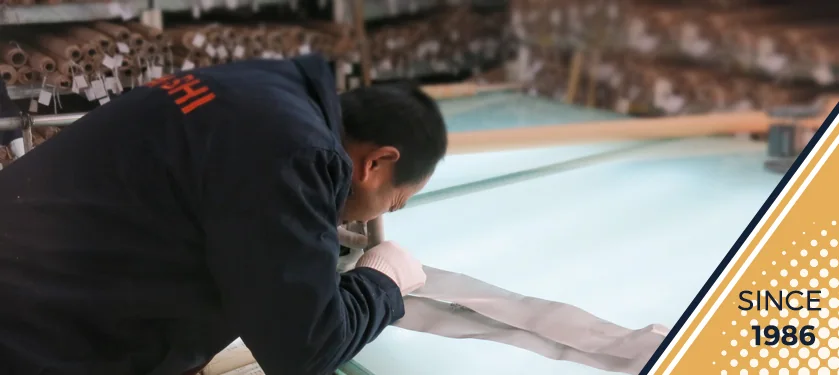 MAISHI worker inspecting mesh pre-delivery
